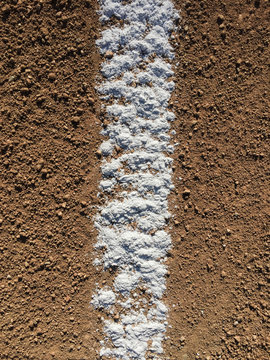 Close up of white boundary marks on baseball field