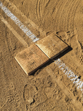 View of first base and painted boundary line on baseball field