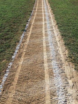 Close up of white boundary marks on baseball field