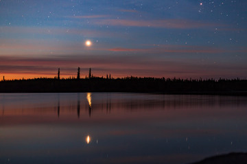Pre-dawn on Ontario's Winisk River. Venus, the morning star, rises above Ontario Ring of Fire. 