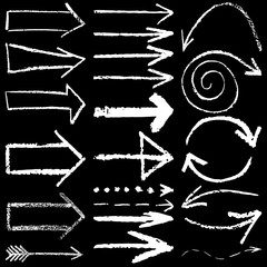 set of vector illustration of hand drawn chalk arrows isolated on black background