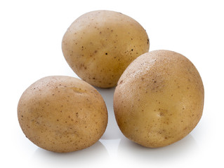Three new tubers of potato isolated on white background, close up.