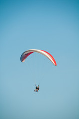 Paraglider flies paraglider in the sky. Paragliding.