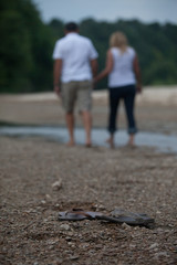 Couple on Beach with Sandals