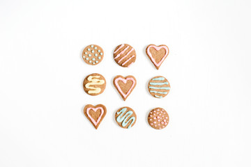 Colorful hand made cookies on white background. Flat lay, top view.
