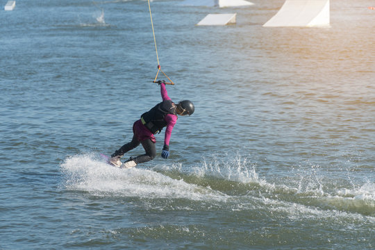 The Excited Feeling Of Asian Young Girl Wake Boarding On A Lake With Cable In Thailand