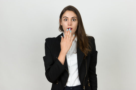 Young young businesswoman covering the mouth with her hands