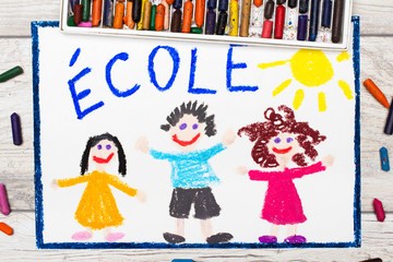 Obraz na płótnie Canvas Photo of colorful drawing: French word SCHOOL and happy children. First day at school.