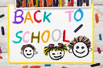 Photo of  colorful drawing: Word BACK TO SCHOOL and happy children. First day at school.