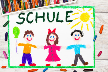 Obraz na płótnie Canvas Photo of colorful drawing: German word SCHOOL and happy children. First day at school.
