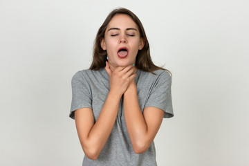 Young woman with sore throat.