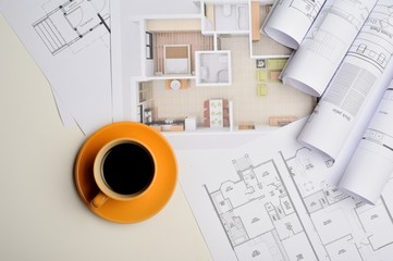 Architectural plan. Engineering house drawings coffee on the table