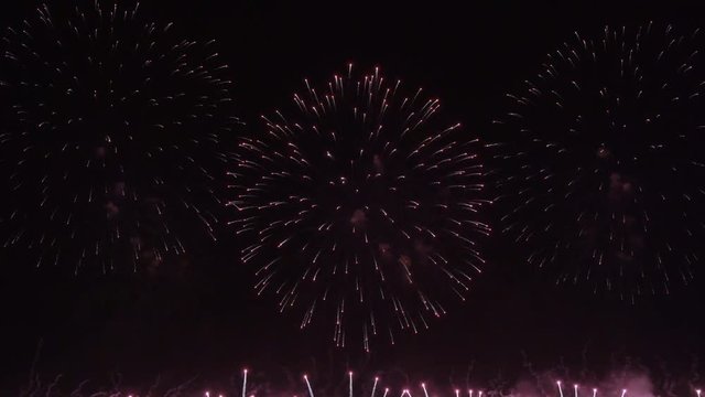 Colorful fireworks on the black sky background 4K