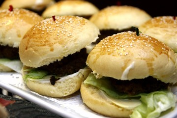 Hamburger sandwiches served on a tray