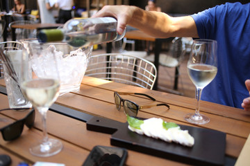 Fototapeta na wymiar Gentleman pouring wine. Close up