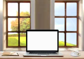 Fototapeta premium Blank screen laptop, coffee cup and notebook on wood table with windows view background.