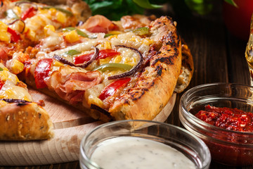 Homemade pizza with bacon, paprika and corn