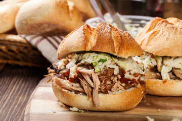 Homemade pulled pork burger with coleslaw salad