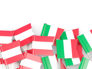 Flag pins of Austria and Italy isolated on white