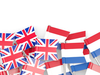 Flag pins of United Kingdom and Netherlands isolated on white
