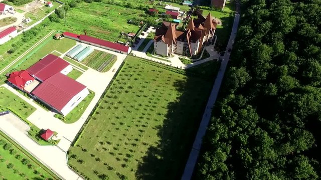 Panoramic aerial video of gardens and greenhouses at the mountain resort