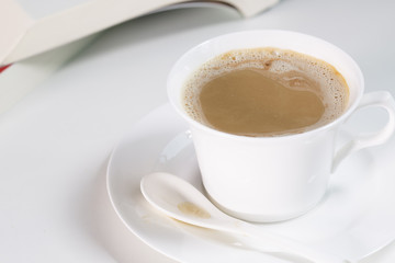 Mocha coffee cup and one book.