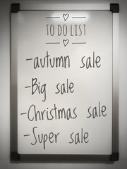 To do list on whiteboard for remind to go big, super, autumn and Christmas sale.