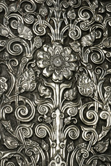  flower in metal ,hammered, chased 