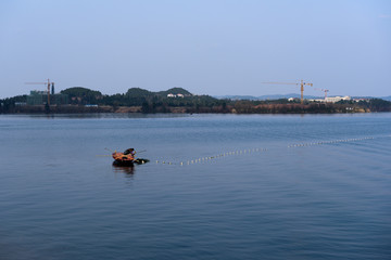 Fish man on lake