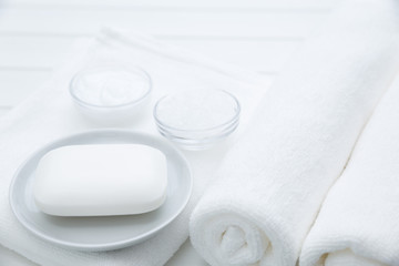 Fototapeta na wymiar All White Spa and Bath Image - Towels, Soap, Bath Salt and Cosmetic Cream