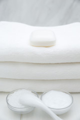 Fototapeta na wymiar All White Spa and Bath Image - Towels, Soap, Bath Salt and Cosmetic Cream