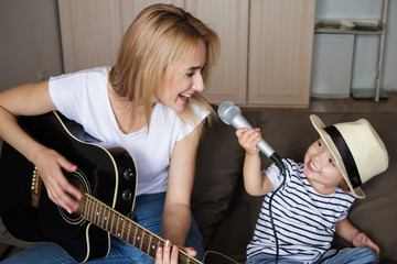 Sisters playing the guitar and singing