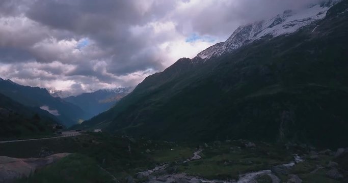 Beautiful aerial panorama of the swiss alps, drone shot along the wild in Switzerland
