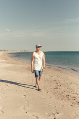 young handsome man on the beach