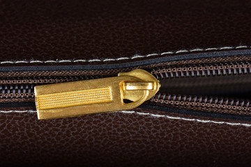 Metal zipper on leather fragment