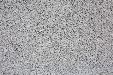 a grey background for plastered wall of house