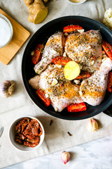 Prepare the chicken for stewing in the oven. The main dish is marinated chicken in herbs and olive oil with vegetables.