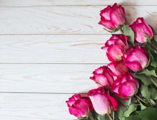 Fototapeta na wymiar Fresh flowers Roses on Table Wall Copy Space