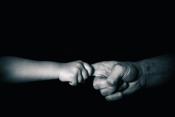 Connected hands of father and his child