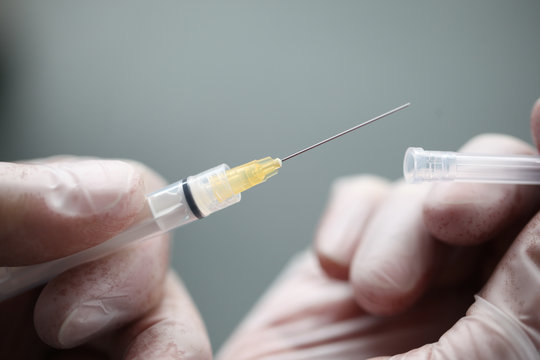 close up of syringe needle, ampoule, transparent, liquid