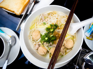 Asian cuisine, rice noodles with pork ball.