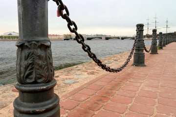 metal fence the river with chains on poles in Saint Petersburg