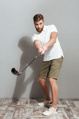 Full length image of a golfer playing in golf