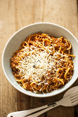 Spaghetti Bolognese with minced beef, tomato sauce, grated parmesan