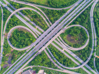 Aerial view, Road roundabout, Expressway with car lots in the city in Thailand.  beautiful Street , downtown, cityscape, Top view. Background