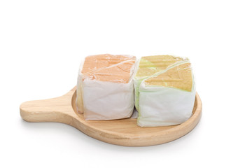 orange and pandan  Chiffon cake on wooden plate