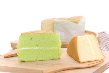 orange and pandan  Chiffon cake on wooden plate
