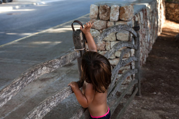 Child trying to open the door, safety concept 