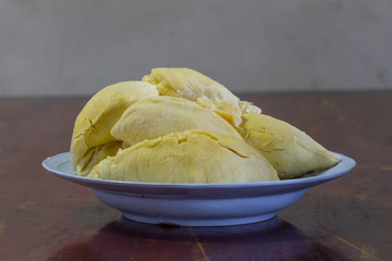 Durian thai fruit on plate on old wood