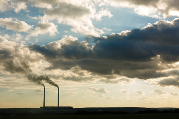 Plant's tubes with smoke and blue sky